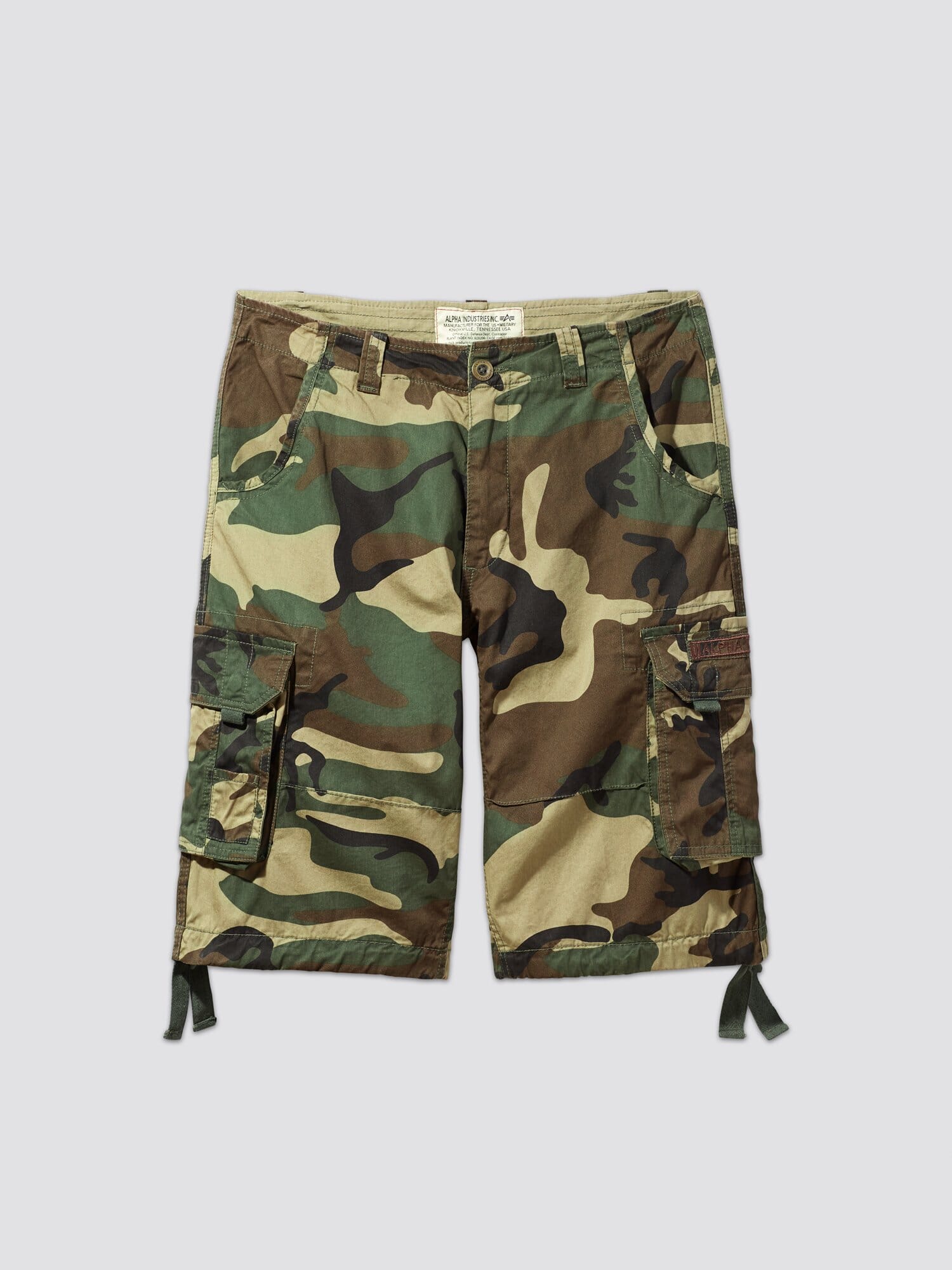 Alpha Industries Jet Short Camo, cotton camo cargo shorts with side pockets, button-zip closure, and drawstring leg ties.