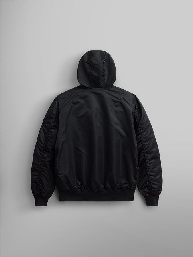 A black L-2B Hooded Gen II Bomber Jacket by Alpha Industries, Inc., featuring a minimalist design, is displayed from the back.