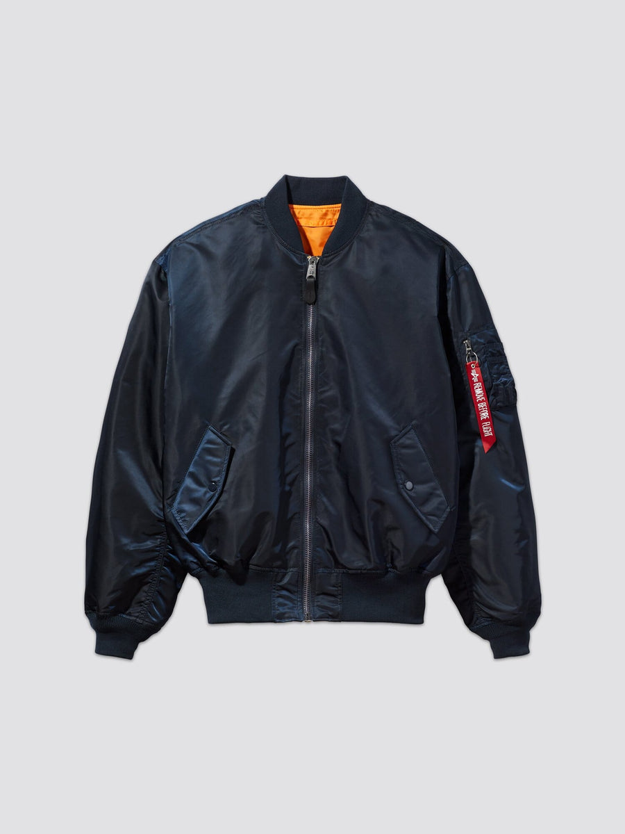 Alpha Industries L-2b Loose Bomber Jacket, black, water resistant, front zipper, ribbed cuffs and hem, orange lining, sleeve zip pocket with red tag.
