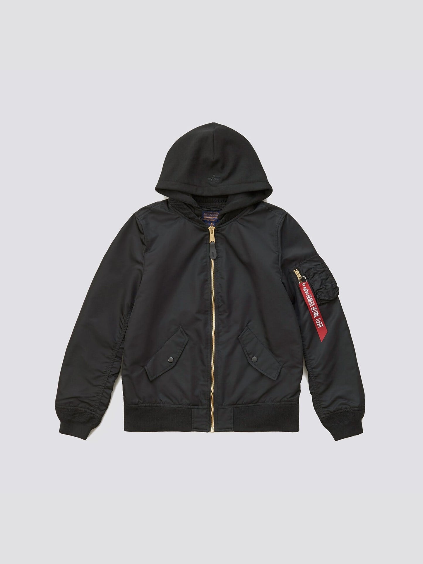 Alpha Industries L-2B Natus W Bomber Jacket, black, zip-up flight jacket with removable hood, front pockets, MA-1 red tag on left sleeve.