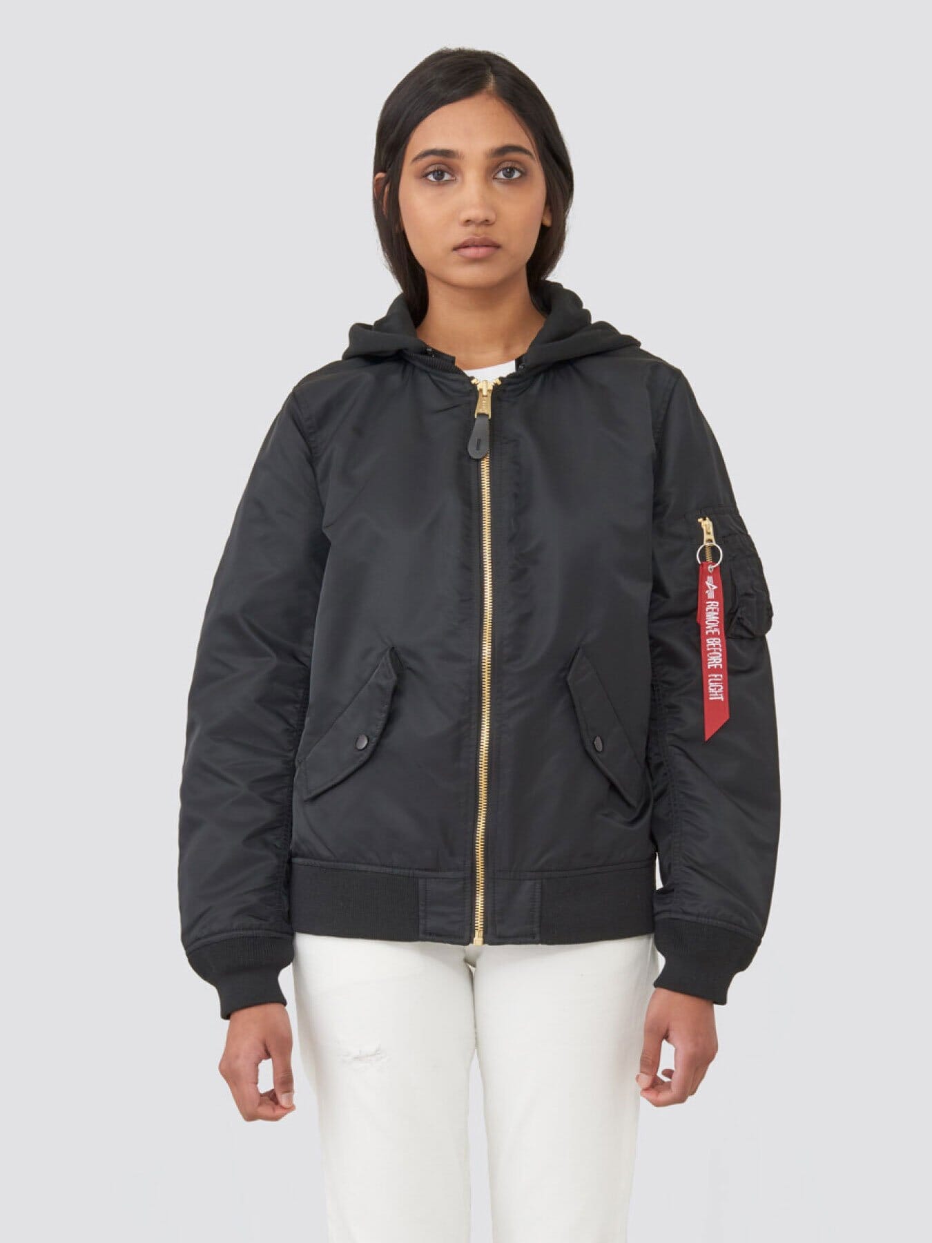 Alpha Industries L-2B Natus W Bomber Jacket, black, red sleeve tag, zipper closure.