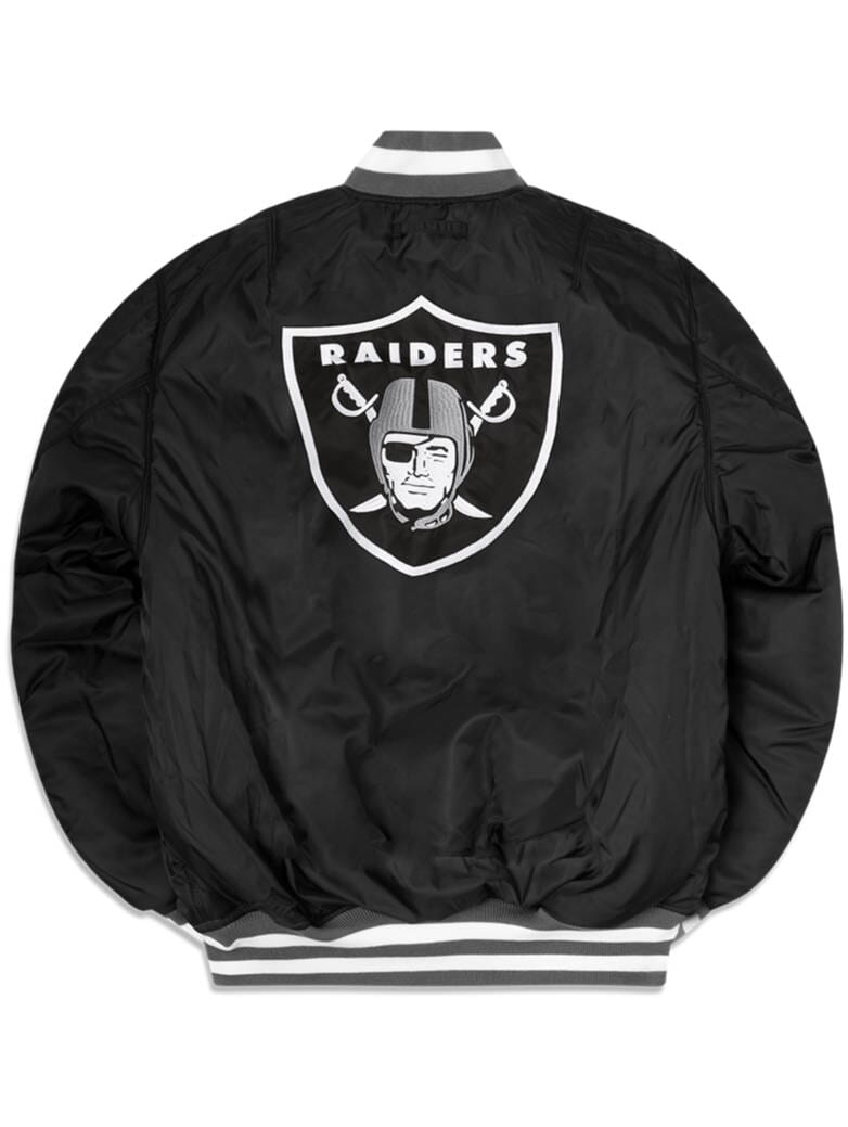 Introducing the Las Vegas Raiders X Alpha X New Era MA-1 Bomber Jacket by Alpha Industries and NE-NFL. This stylish bomber jacket features a prominent Raiders logo on the back, enhanced by white accents on the collar, cuffs, and hem. Enjoy both fashion and functionality with its water-resistant finish.