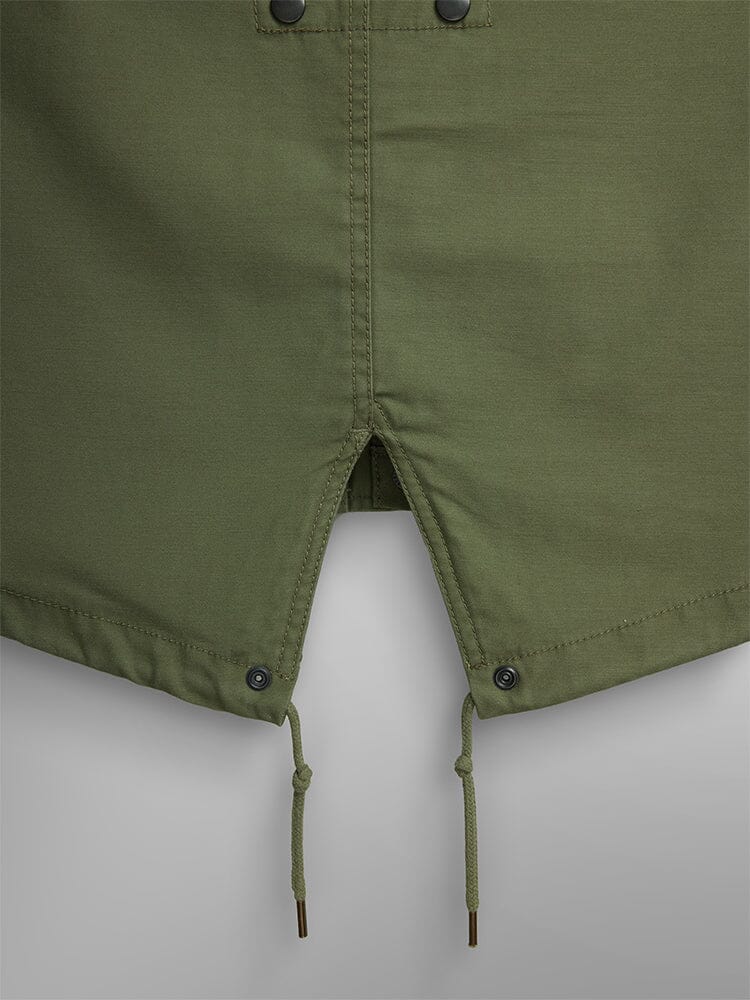 Alpha Industries M-59 Fishtail Mod Parka in olive green with center slit, metal grommet drawstrings, and quilted fishtail liner.