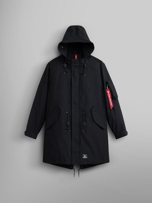 Alpha Industries M-59 Fishtail Mod Parka in Black with front flap pockets, moldable wire hood, drawstring details, and red Remove Before Flight tag on left sleeve.
