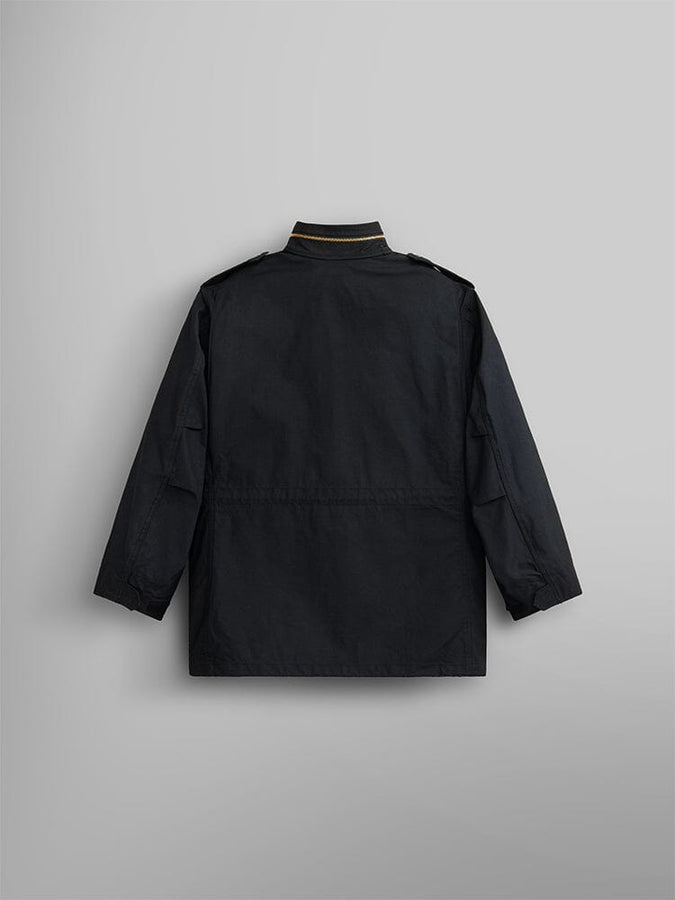 Alpha Industries M-65 Field Jacket in black, water-resistant material, straight hem, MA-1 military-inspired epaulets on shoulders.