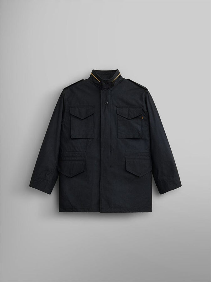 Alpha Industries M-65 Field Jacket in black with four front pockets, high collar, and buttoned shoulder epaulettes.