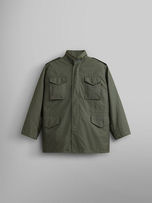 Alpha Industries M-65 Field Jacket in olive with four front pockets, stand collar, and long sleeves.