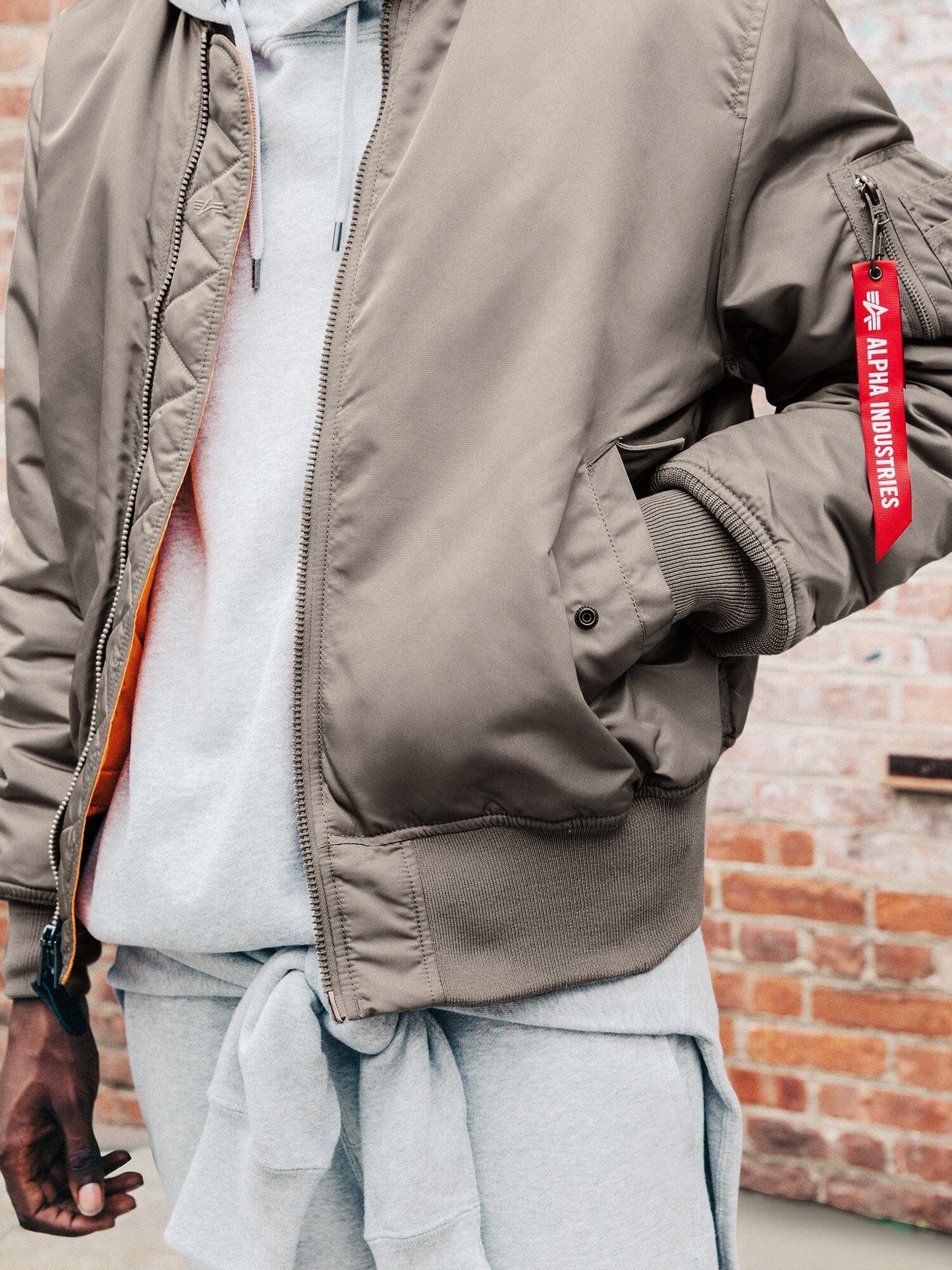 Front view of MA-1 Bomber Jacket (Heritage) in Gray with male model. Front pocket view. By Alpha Industries.