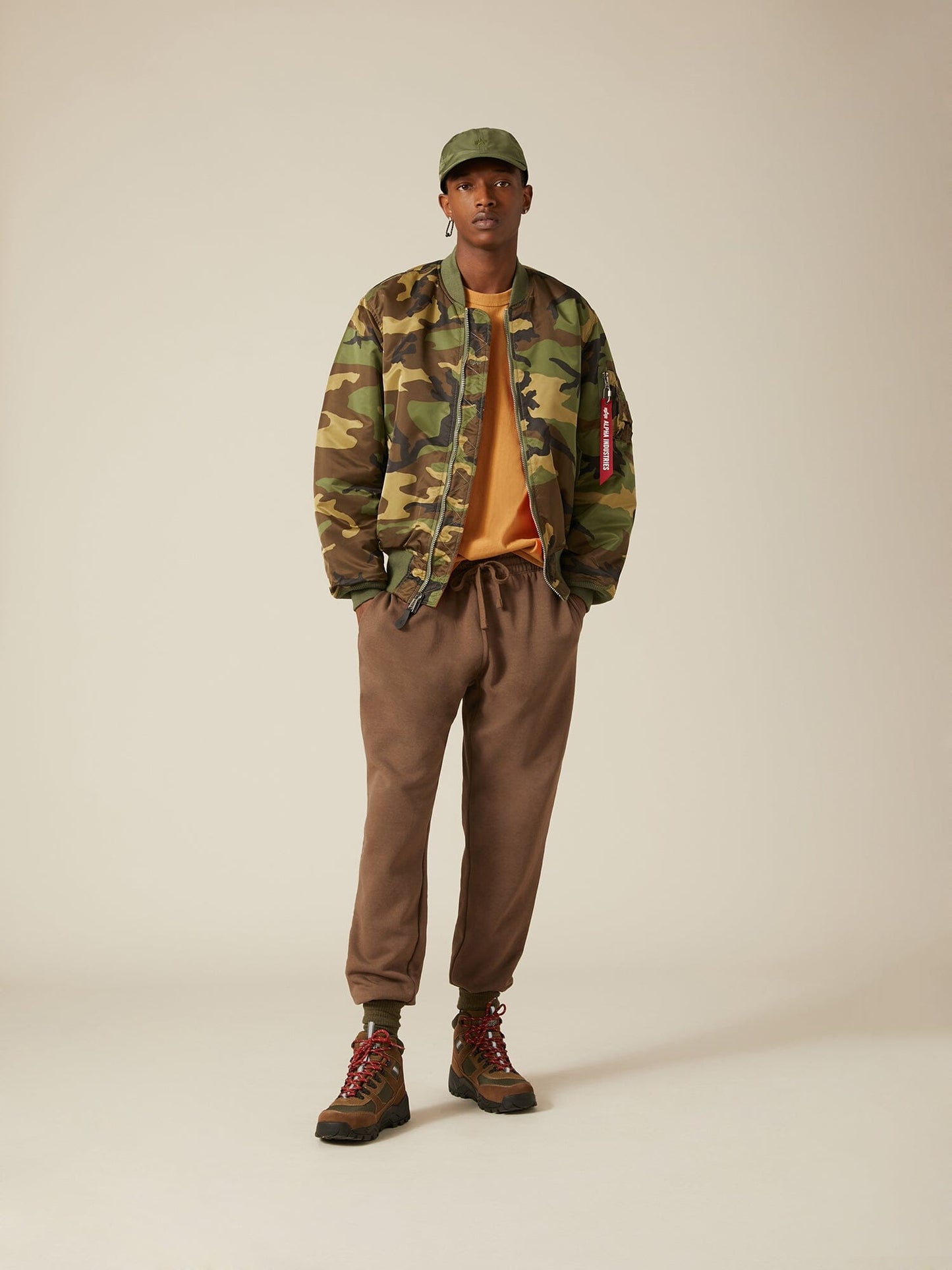 Front view of MA-1 Bomber Jacket (Heritage) in Woodland Camo with male model. Full body view. By Alpha Industries.