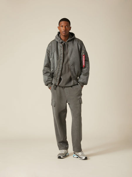 Front view of MA-1 Bomber Jacket (Heritage) in Sliver (Gunmetal) with male model. Full body view. By Alpha Industries.