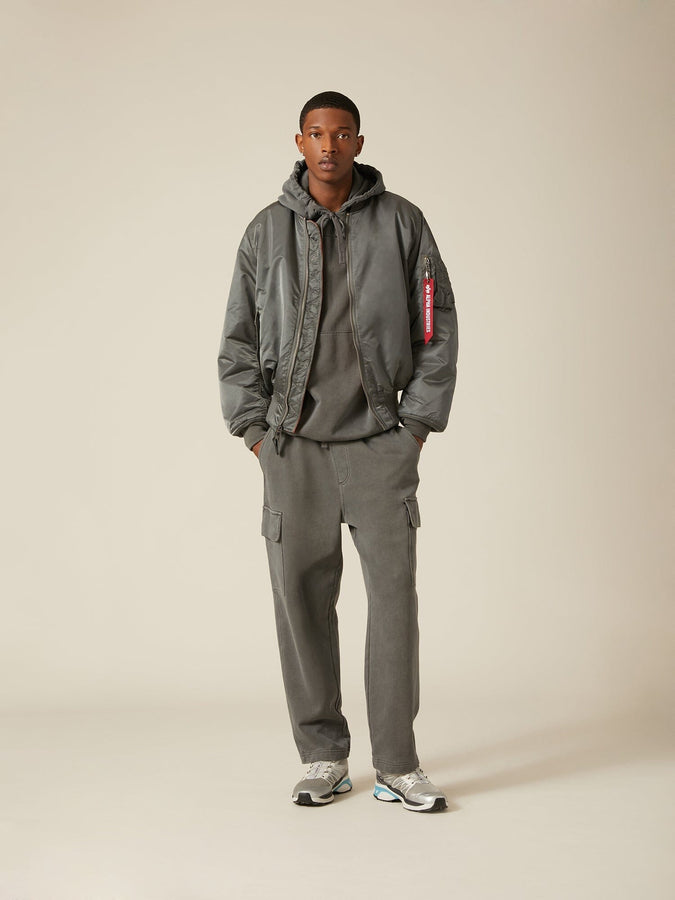 Front view of MA-1 Bomber Jacket (Heritage) in Sliver (Gunmetal) with male model. Full body view. By Alpha Industries.