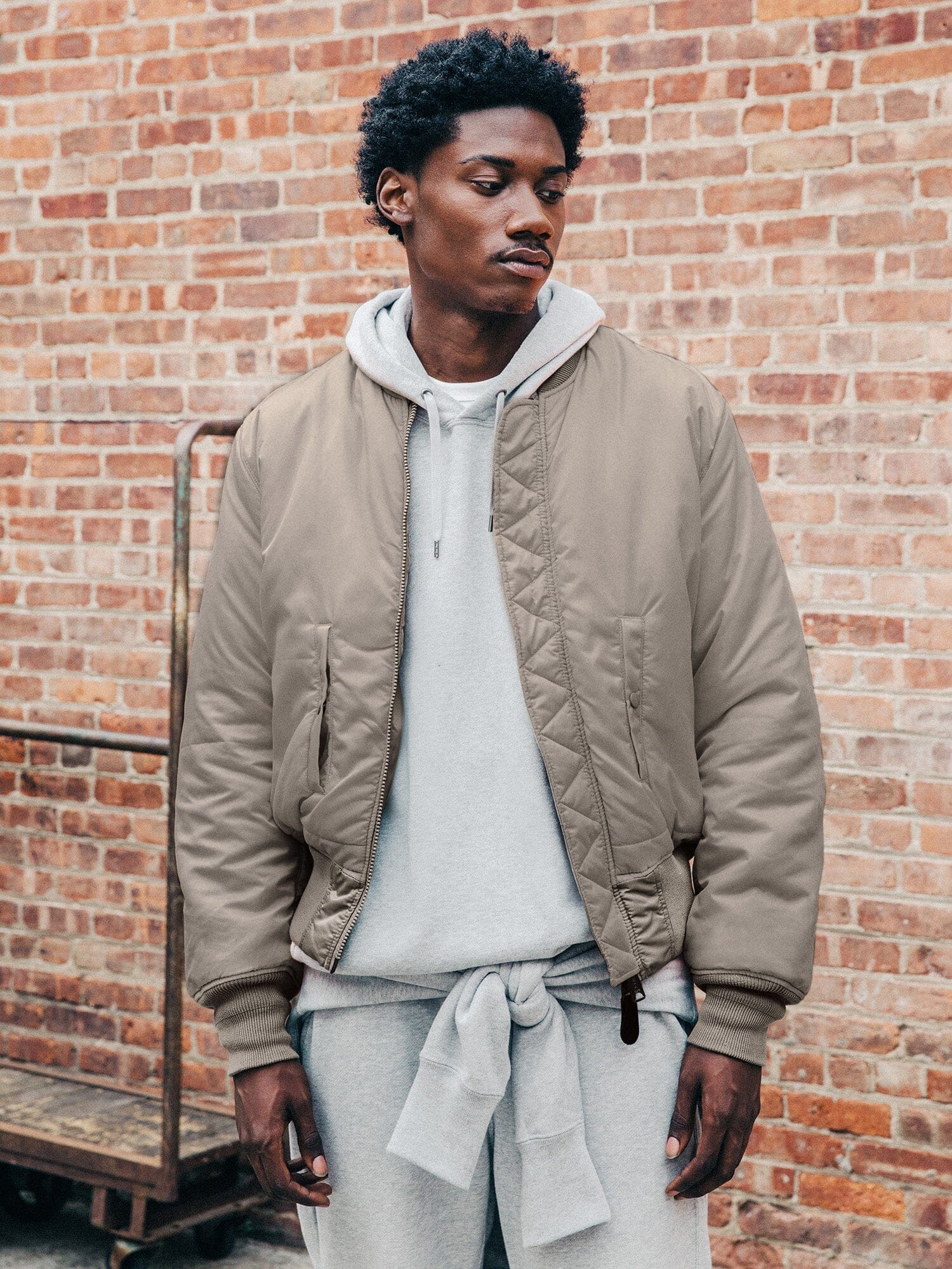 Front view of MA-1 Bomber Jacket (Heritage) in Gray with male model. Knees up view. By Alpha Industries.