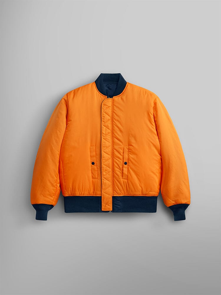 Alpha Industries MA-1 Bomber Jacket in bright orange flight nylon with navy blue cuffs, collar, and waistband.