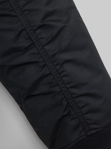 Close up view of MA-1 Bomber Jacket (Heritage) in Black. Sleeve stiching. By Alpha Industries.