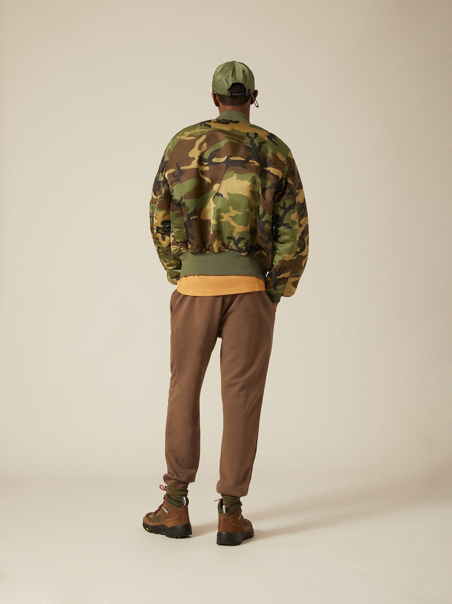Back view of MA-1 Bomber Jacket (Heritage) in Woodland Camo with male model. Full body view. By Alpha Industries.