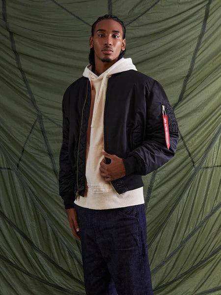 Front view of MA-1 Bomber Jacket (Heritage) in Black with male model. Knees up view. By Alpha Industries.