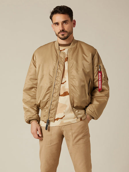 Front view of MA-1 Bomber Jacket (Heritage) in Khaki (Vintage) with male model. Knees up view. By Alpha Industries.