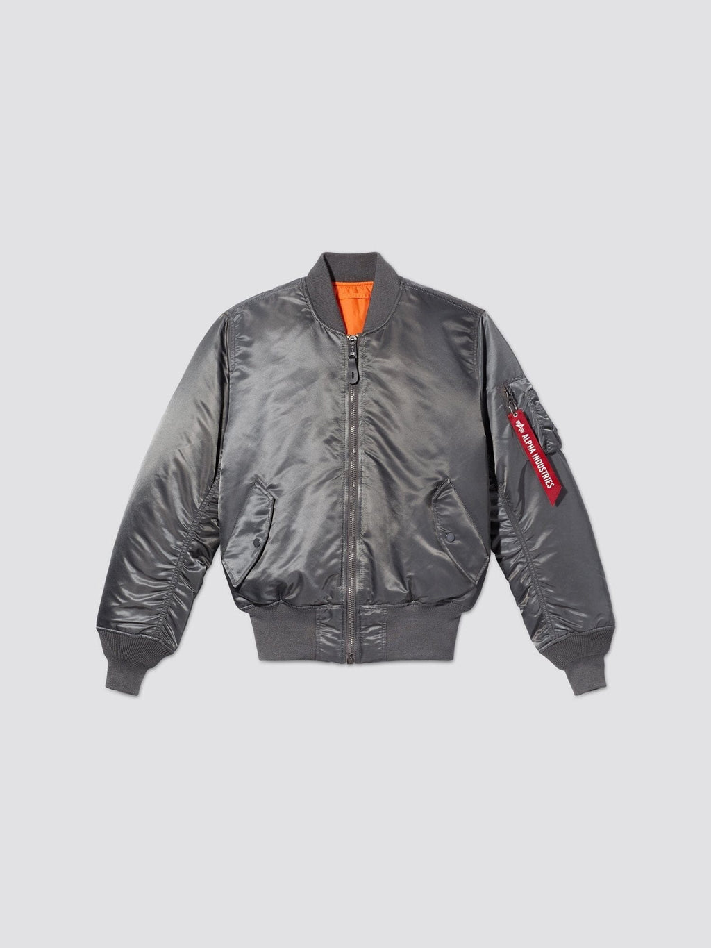 Alpha Industries MA-1 Bomber Jacket, gray with orange lining, front zipper, ribbed cuffs and hem, red tag on left sleeve pocket.