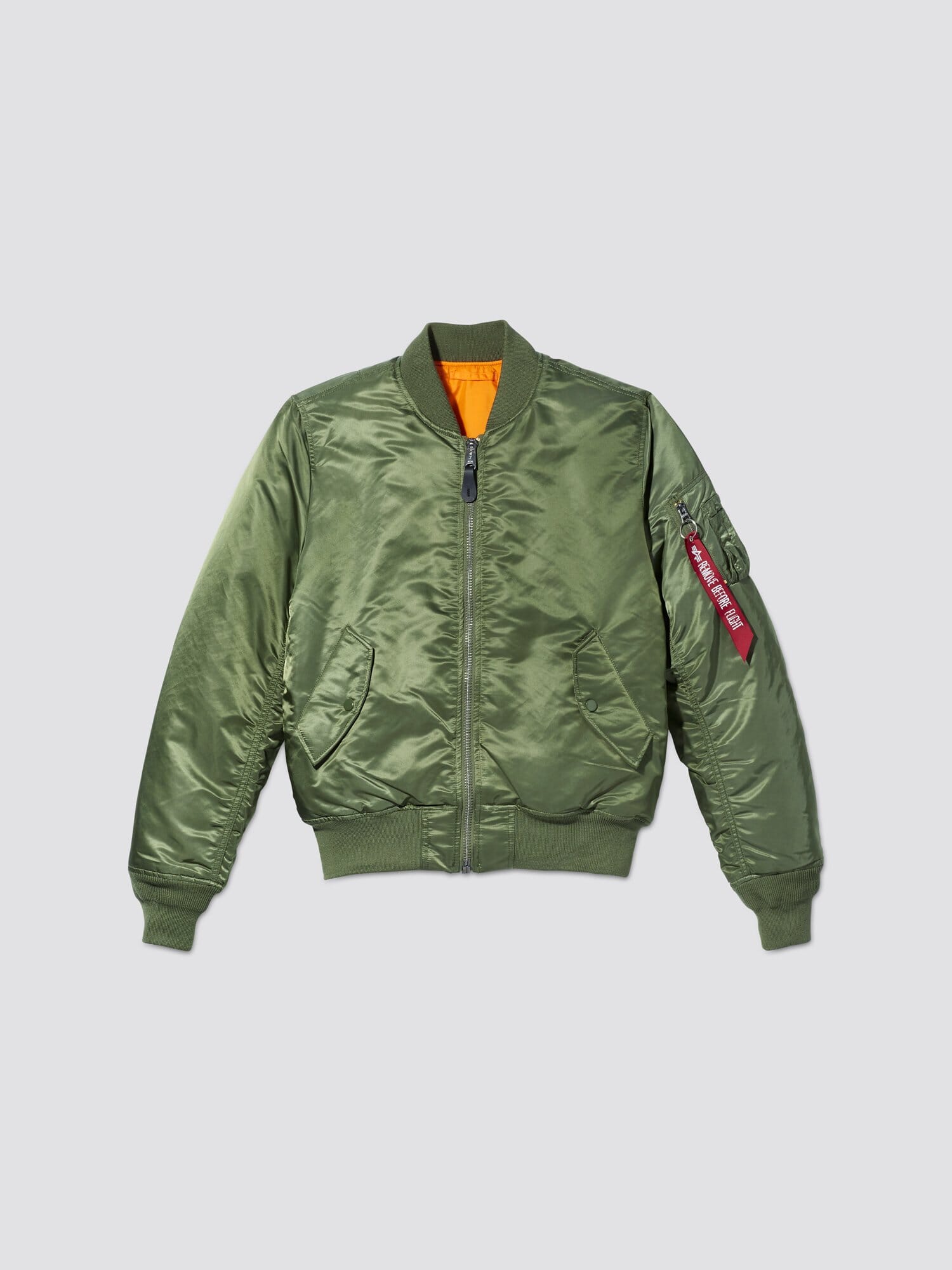 Front flat-lay view of sage green Alpha Industries MA-1 Bomber Jacket Slim Fit showing orange lining and sleeve pocket with red tag.