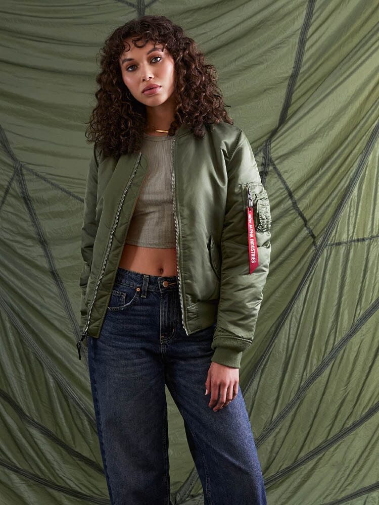 Alpha Industries MA-1 Bomber Jacket Womens in green with front zipper closure.