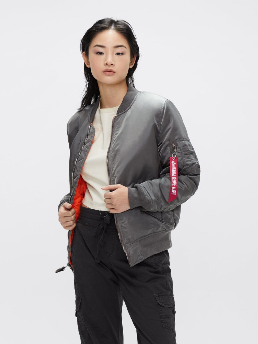 Alpha Industries MA-1 Bomber Jacket W in grey with red sleeve tag and zipper closure.