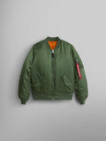 Alpha Industries MA-1 Bomber Jacket Womens in sage with front zipper, two pockets, ribbed cuffs and hem, red sleeve tag, orange lining.