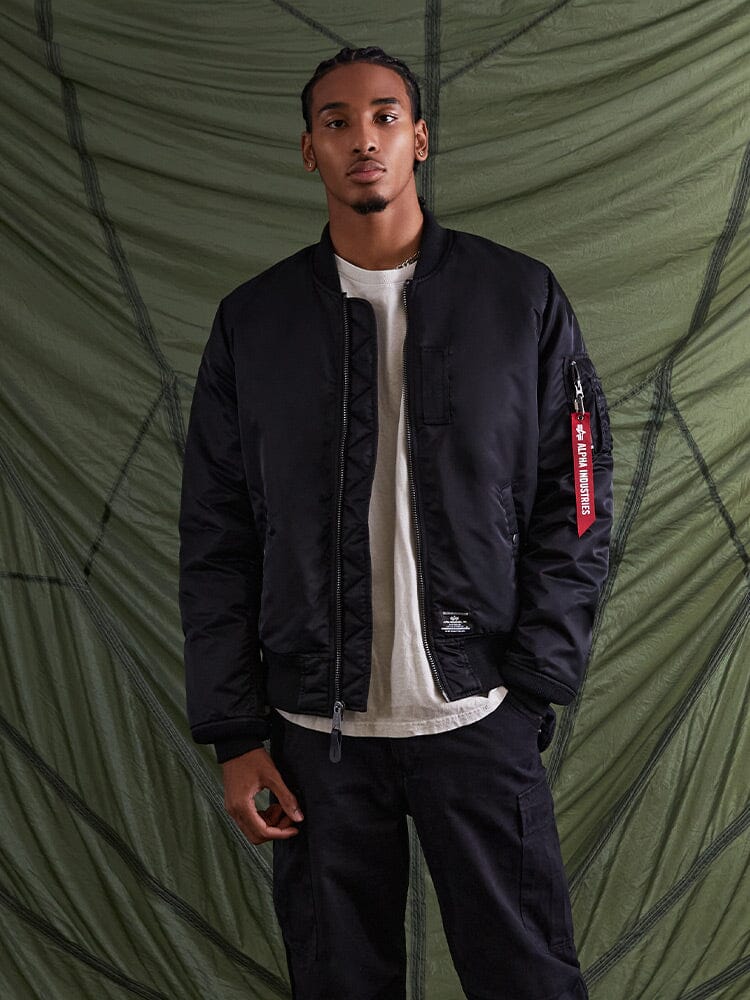 Alpha Industries MA-1 Mod Bomber Jacket in black, featuring zip front and ribbed cuffs.