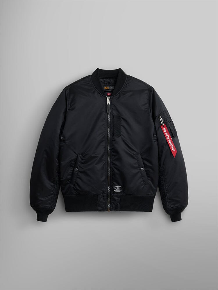 Alpha Industries MA-1 Mod Bomber Jacket in black with front zipper, ribbed cuffs and hem, side pockets, red tag on sleeve pocket.