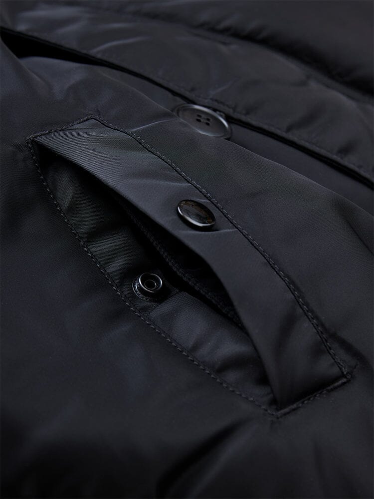 Alpha Industries N-2B Short Waist Parka in black, flap pocket with snap button closure, visible stitching details, water repellent fabric.