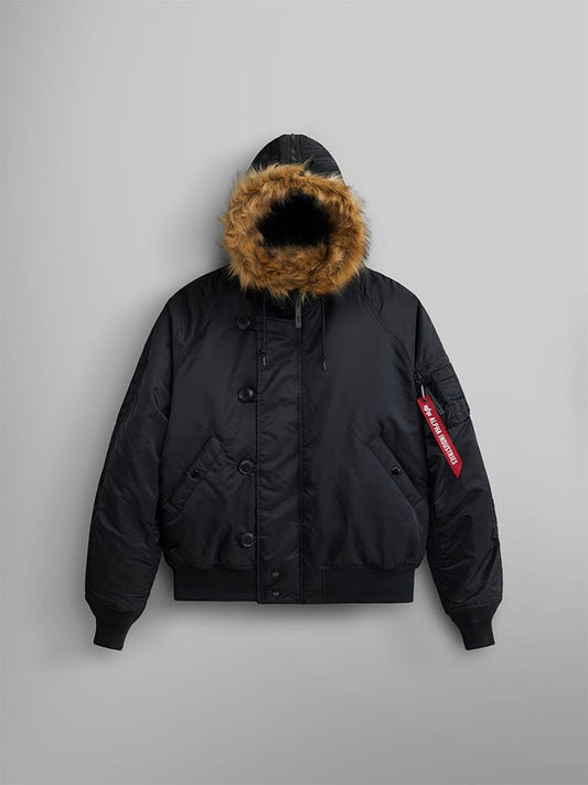 Alpha Industries N-2B Short Waist Parka in black, bomber jacket with faux mouton fur-lined hood, water repellent finish, ribbed cuffs, button and zip closures, red Remove Before Flight sleeve tag.