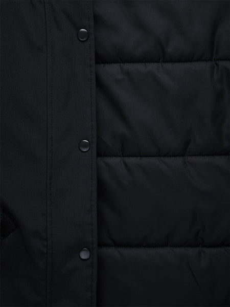 Close-up of the N-3B Altitude Mod Parka W by Alpha Industries, featuring a black padded design with a quilted pattern, snap buttons on the left side, and a snorkel hood for added protection.