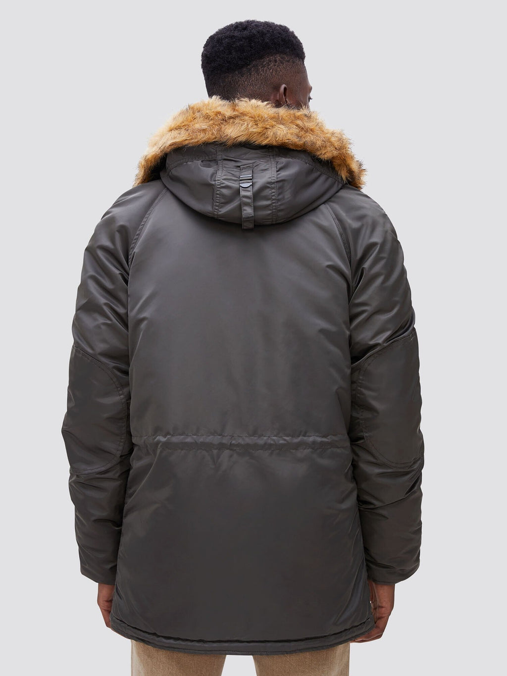 Alpha Industries N-3B Slim Gen I Parka in dark green with faux fur trim.