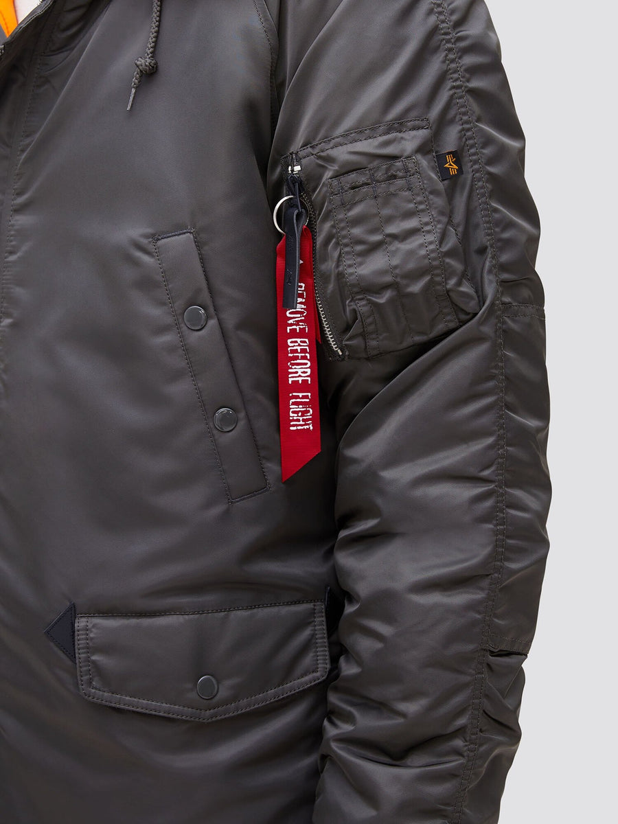 Alpha Industries N-3B Slim Gen I Parka, dark green, water resistant, snap pockets, zippered sleeve pocket, red Remove Before Flight tag.