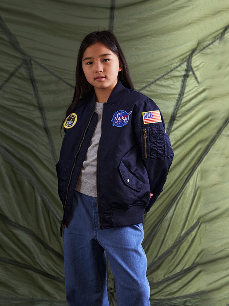 Alpha Industries NASA MA-1 Bomber Jacket Y in green with signature patches and MA-1 utility pocket.