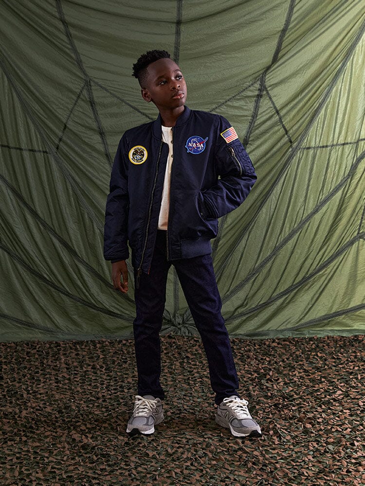 Alpha Industries NASA MA-1 Bomber Jacket Y, dark color, features patch details, front zipper closure.