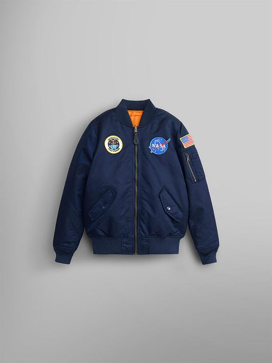 MA-1 Bomber Jacket by Alpha Industries in replica blue with circular mission patch, MA-1 utility pocket, American flag patch on sleeve, and orange lining.