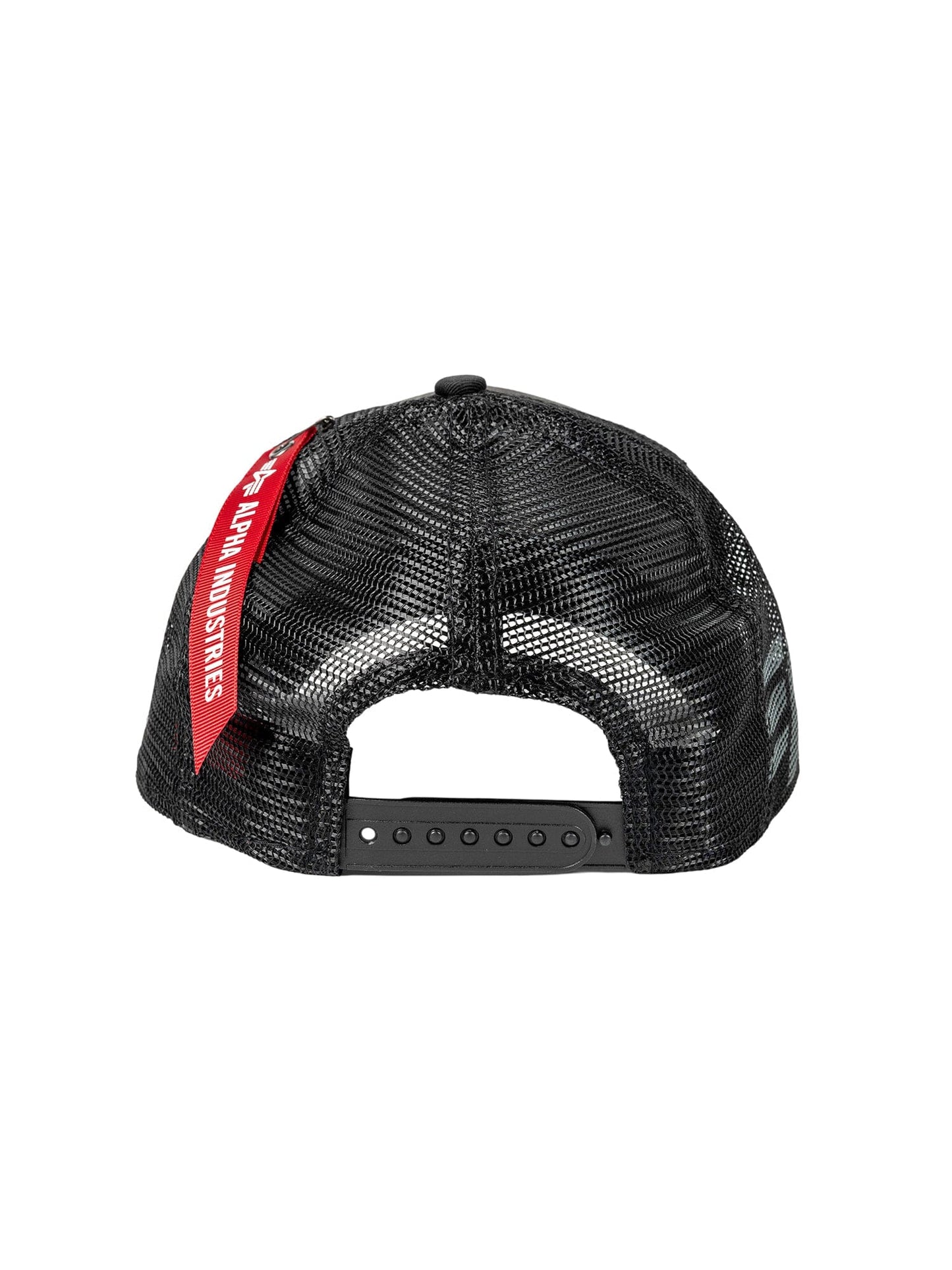 The image showcases the back view of a black mesh 940 A-Frame Trucker baseball cap by Alpha Industries, featuring an adjustable strap and a red tag labeled Alpha Industries.