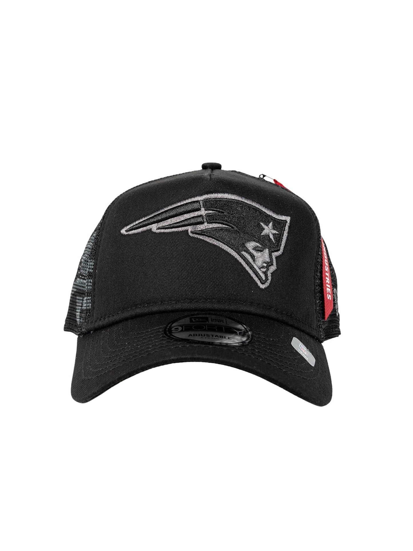 The New England Patriots X Alpha X New Era 940 Cap from Alpha Industries showcases a black mesh design with a stylized logo of a profile wearing a tricorne hat on the front, marrying New Era craftsmanship with classic flair.