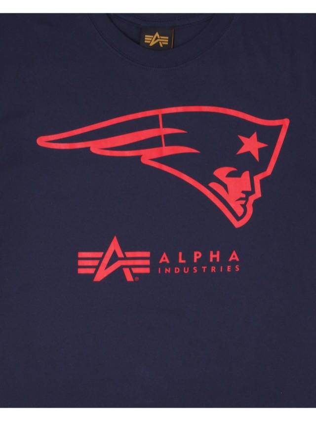 Navy blue t-shirt boasting a bold team logo, highlighting a red stylized patriot head above the Alpha Industries text, by Alpha Industries / NE-NFL.