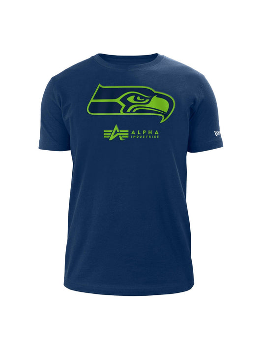 Blue Seattle Seahawks x Alpha x New Era T-shirt featuring a stylized hawk logo in green with twill applique, accompanied by the text "Alpha Industries" below.