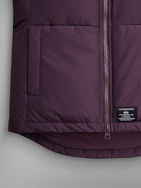 Alpha Industries Short Parka W in maroon with quilting, front zipper, utility and side pockets, black brand label near hem.