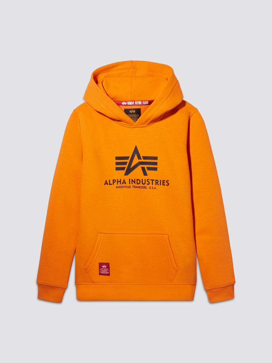 Youth Basic Hoodie by Alpha Industries in Emergency Orange with front pocket, hood, black chest logo, Alpha label, and small red tag on lower left.