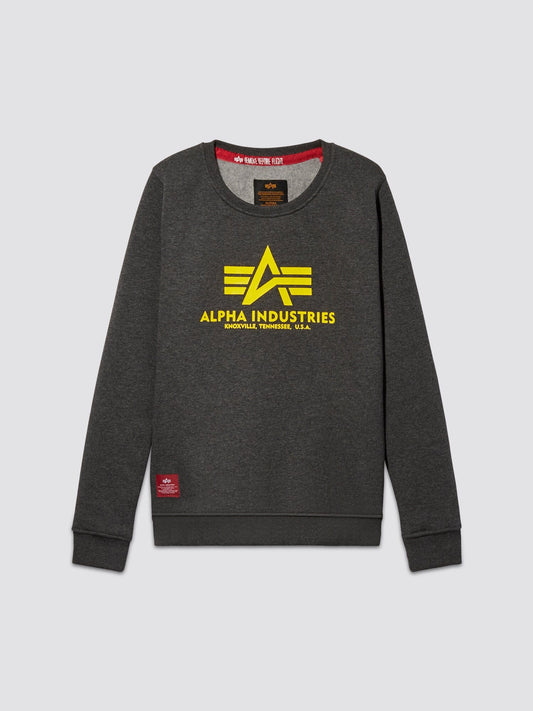 Charcoal heather youth basic sweater featuring a yellow Alpha Industries logo and the text Knoxville, Tennessee, U.S.A. on the front, complemented by a stylish red tag at the bottom hem.