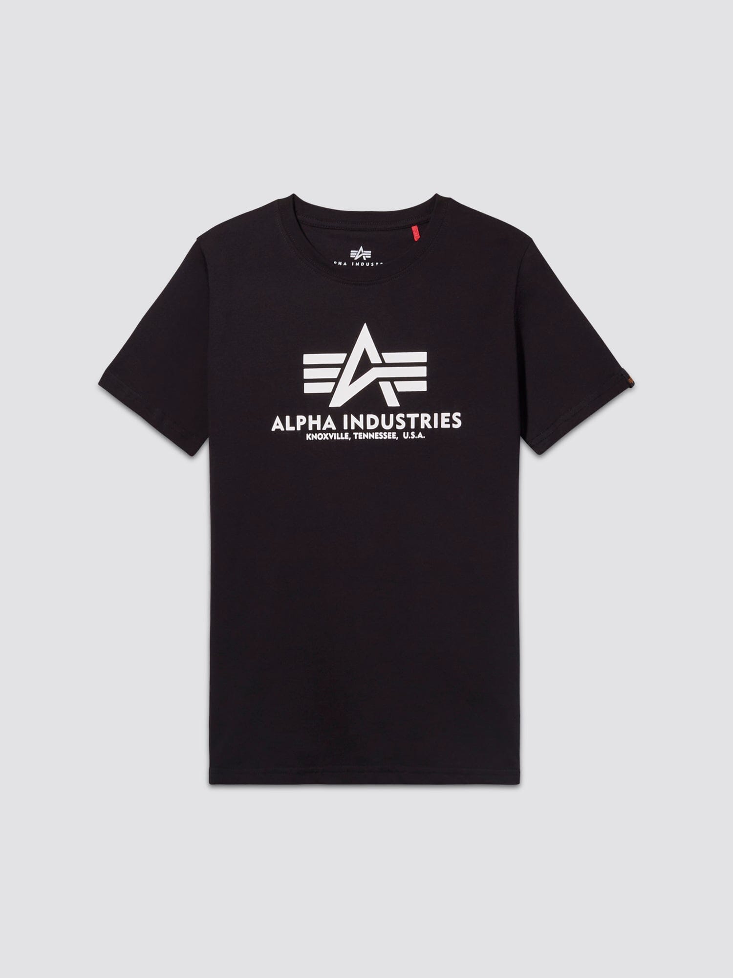 Youth Basic Tee by Alpha Industries in black, with white flag logo and ALPHA INDUSTRIES KNOXVILLE, TENNESSEE, U.S.A. text on front.